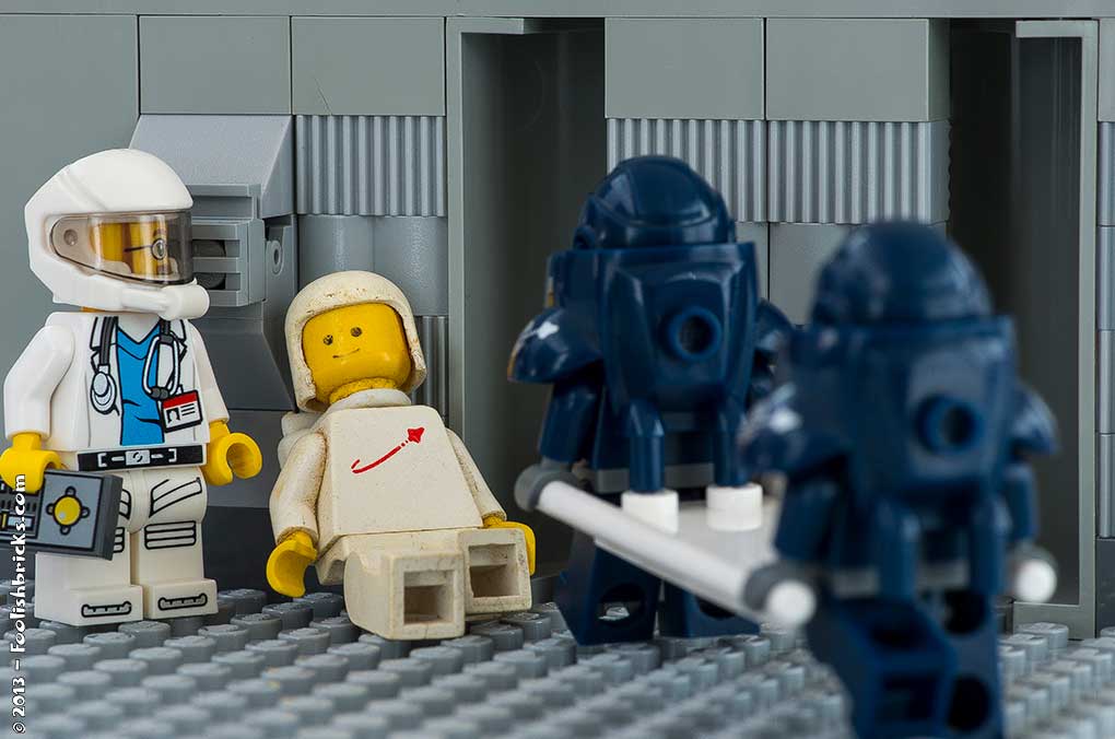 Lego photography - classic lego astronaut rescued by modern astronauts